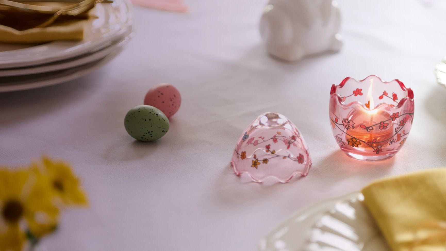 Easter pink with flowers tealight holder on a table setting.