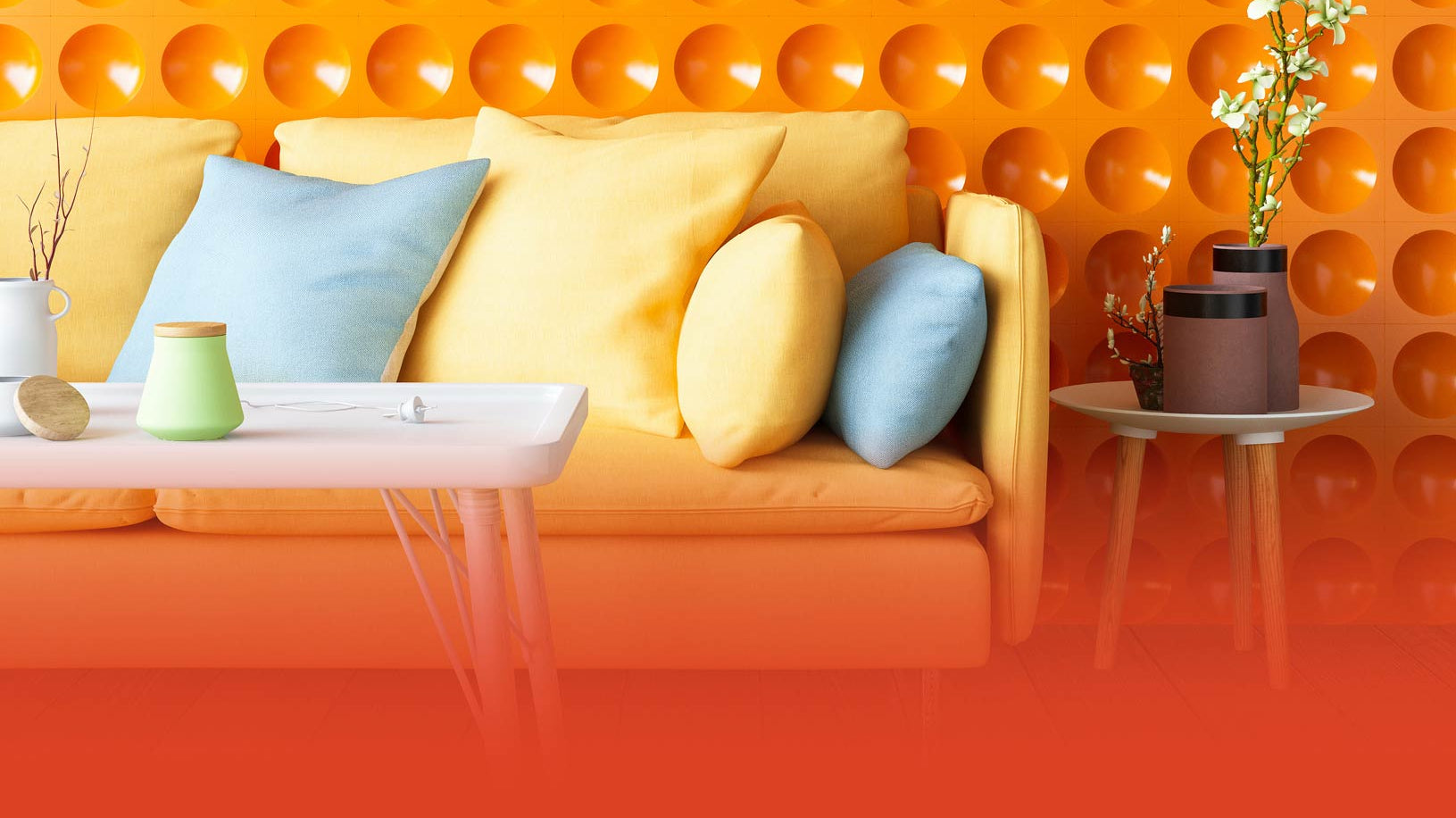 Yellow sofa with colorful yellow and blue cushions against a orange background shown with tables and vases