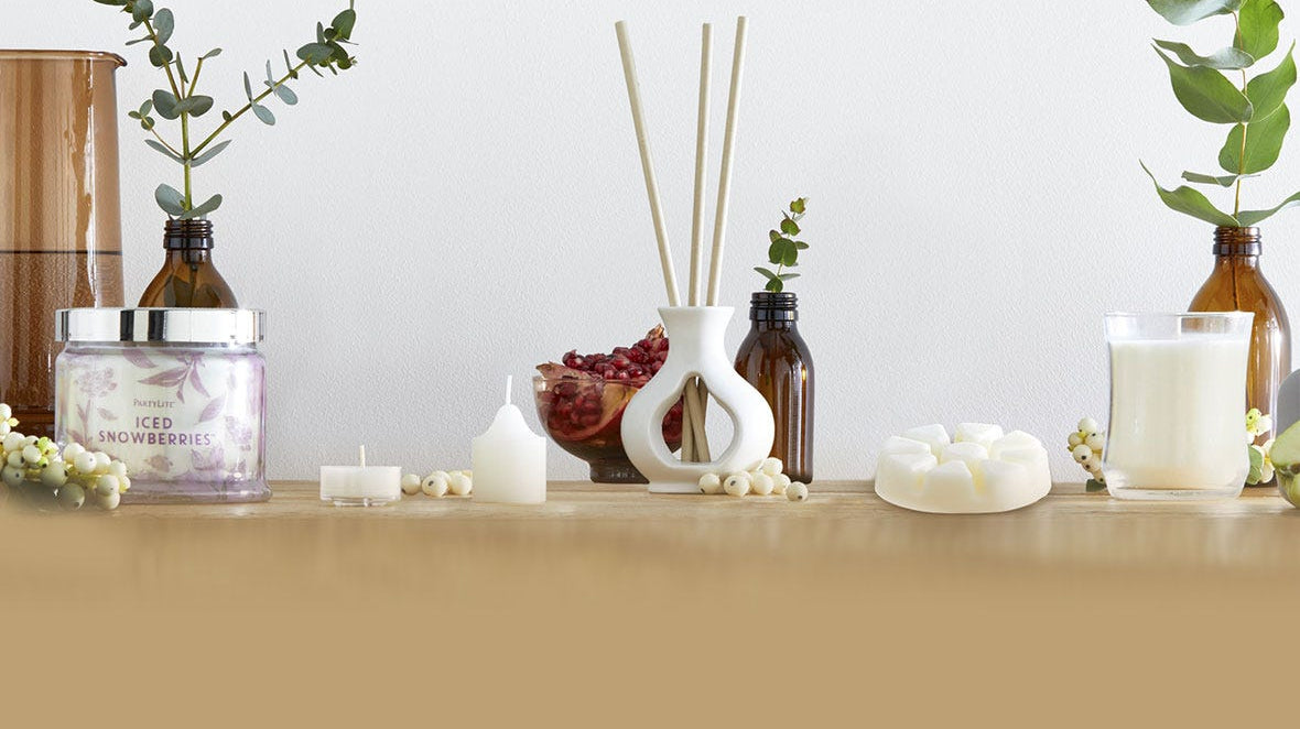 Favorite Smart Sense holder with fragrance sticks shown with jar candles and wax melts.