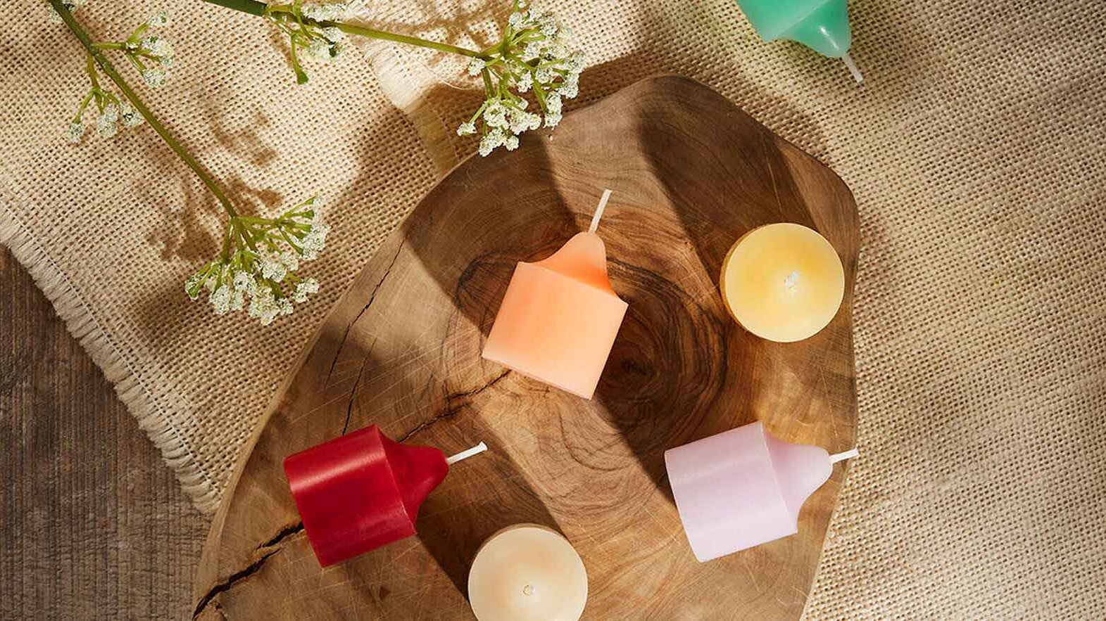 An assortment of votives both standing up and on their side.