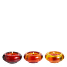 Golden Honey Tealight Holder Trio with lit tealights against a white background.