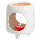 Mini Chiminea Fragrance Warmer with a lit tealight against a white background.