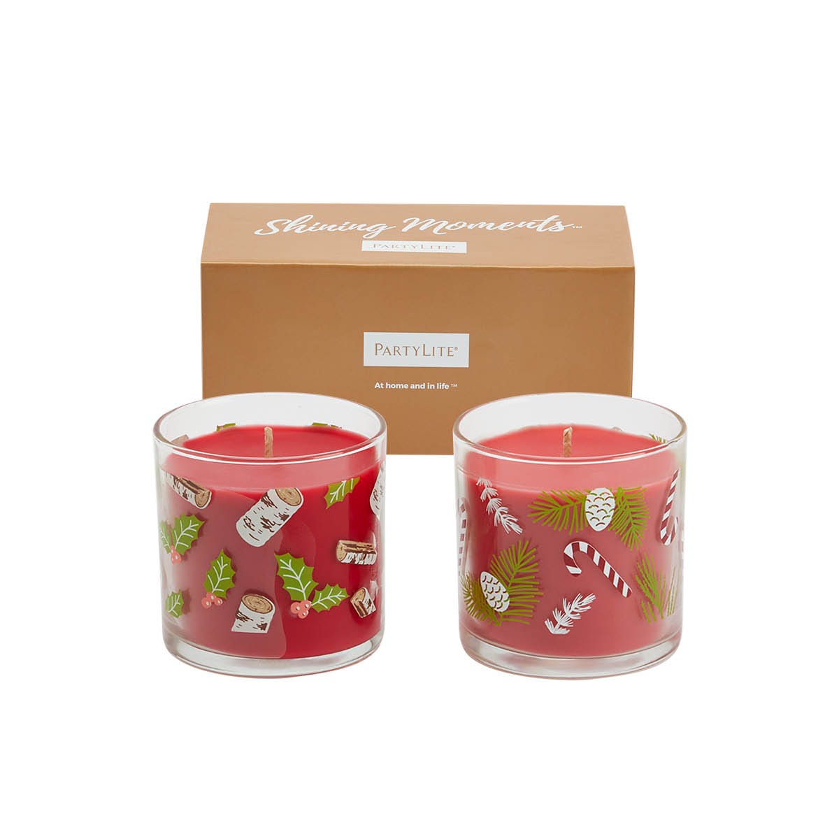 A pair of holiday-themed mini wax in clear jars with Christmas decorations, presented in a box with 'Shining Moments' and 'PartyLite' branding.