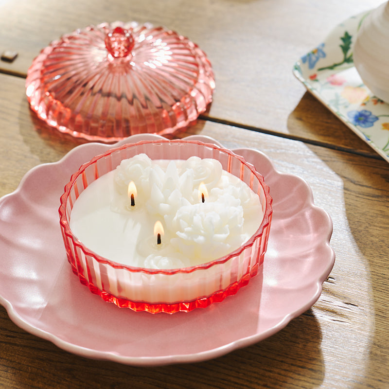 Garden Beauty jar candle that includes flower wax shapes.