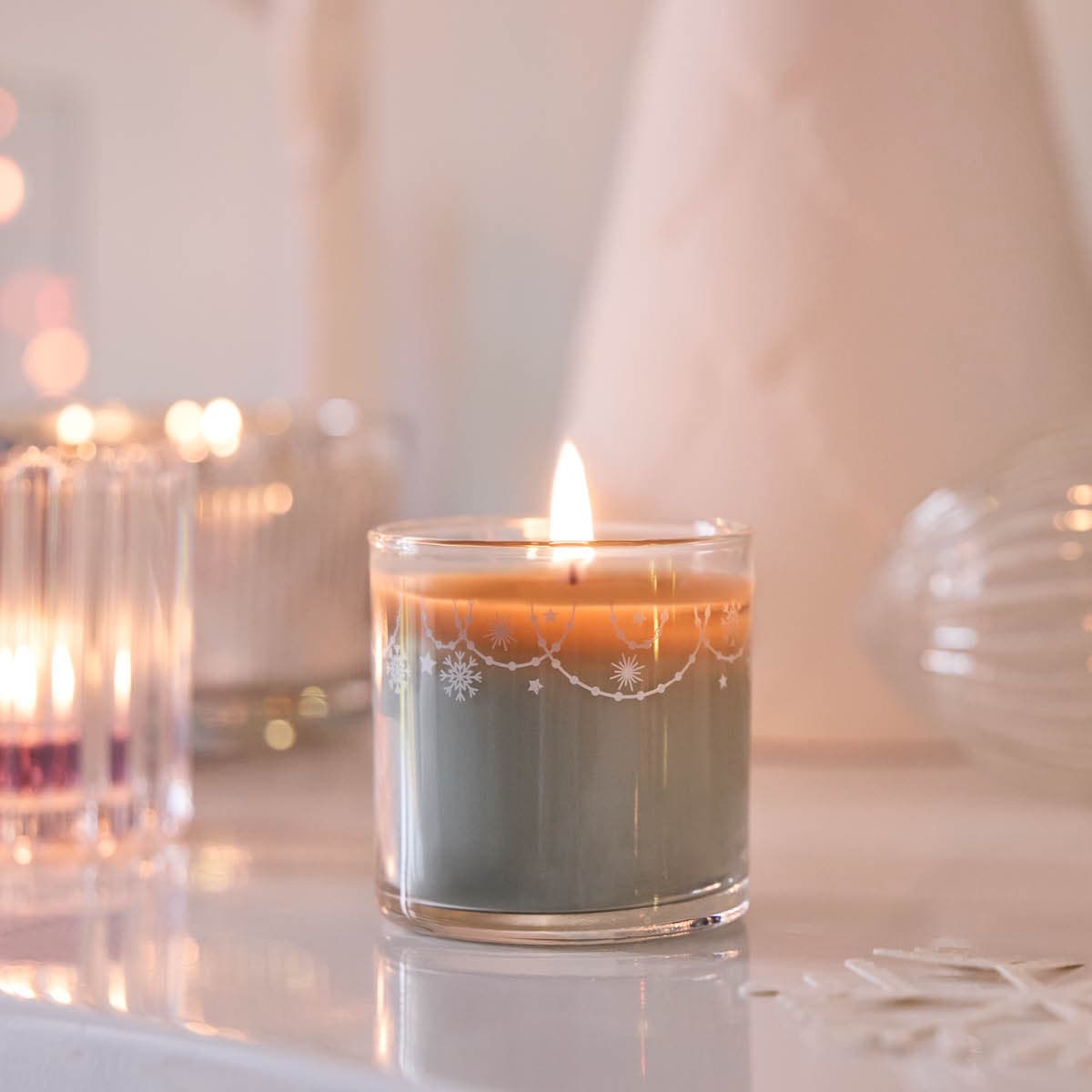 Winter Morning Mini Jar Candle lit against a light background.