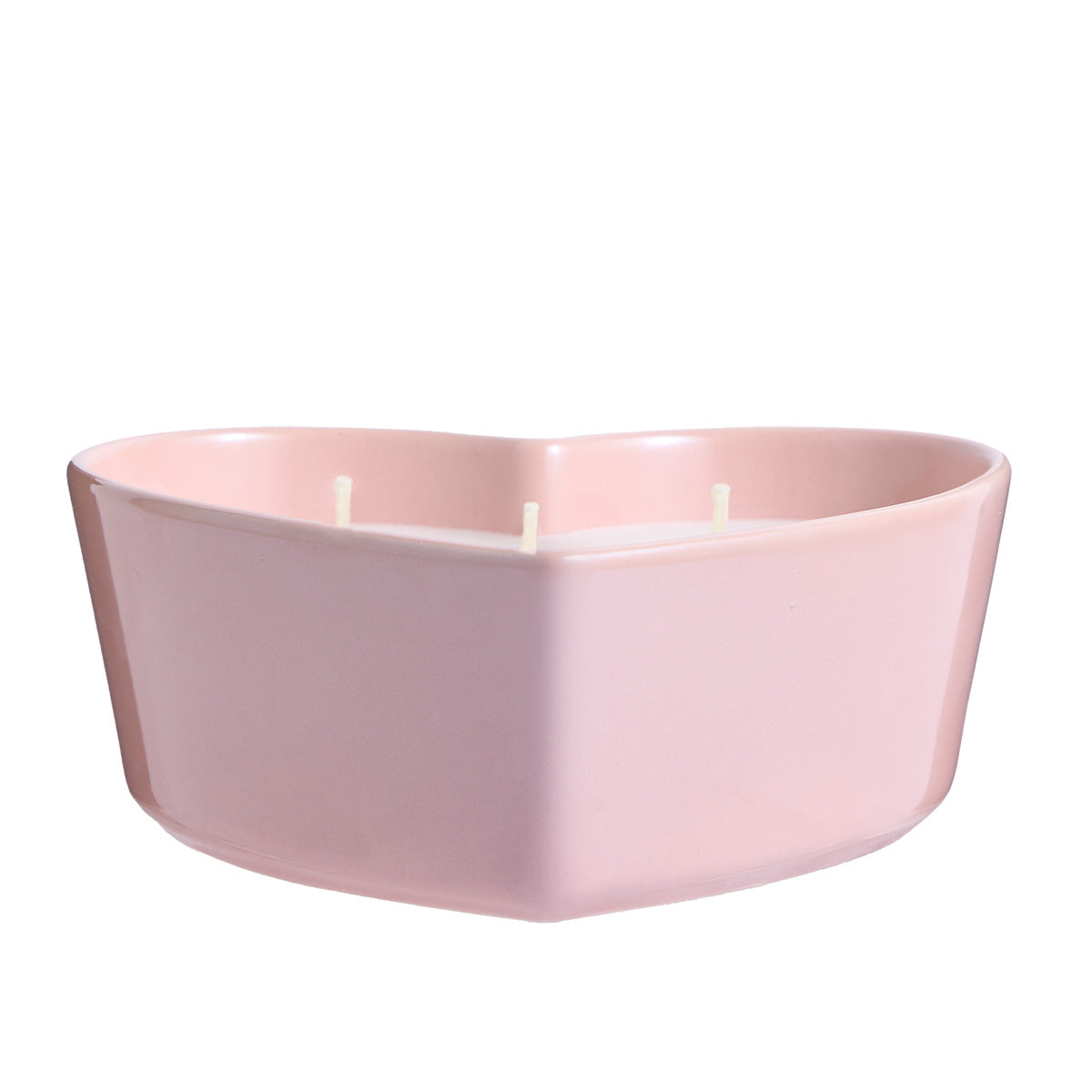 Iced Snowberries Heart shaped pink ceramic jar with white wax against a white background.