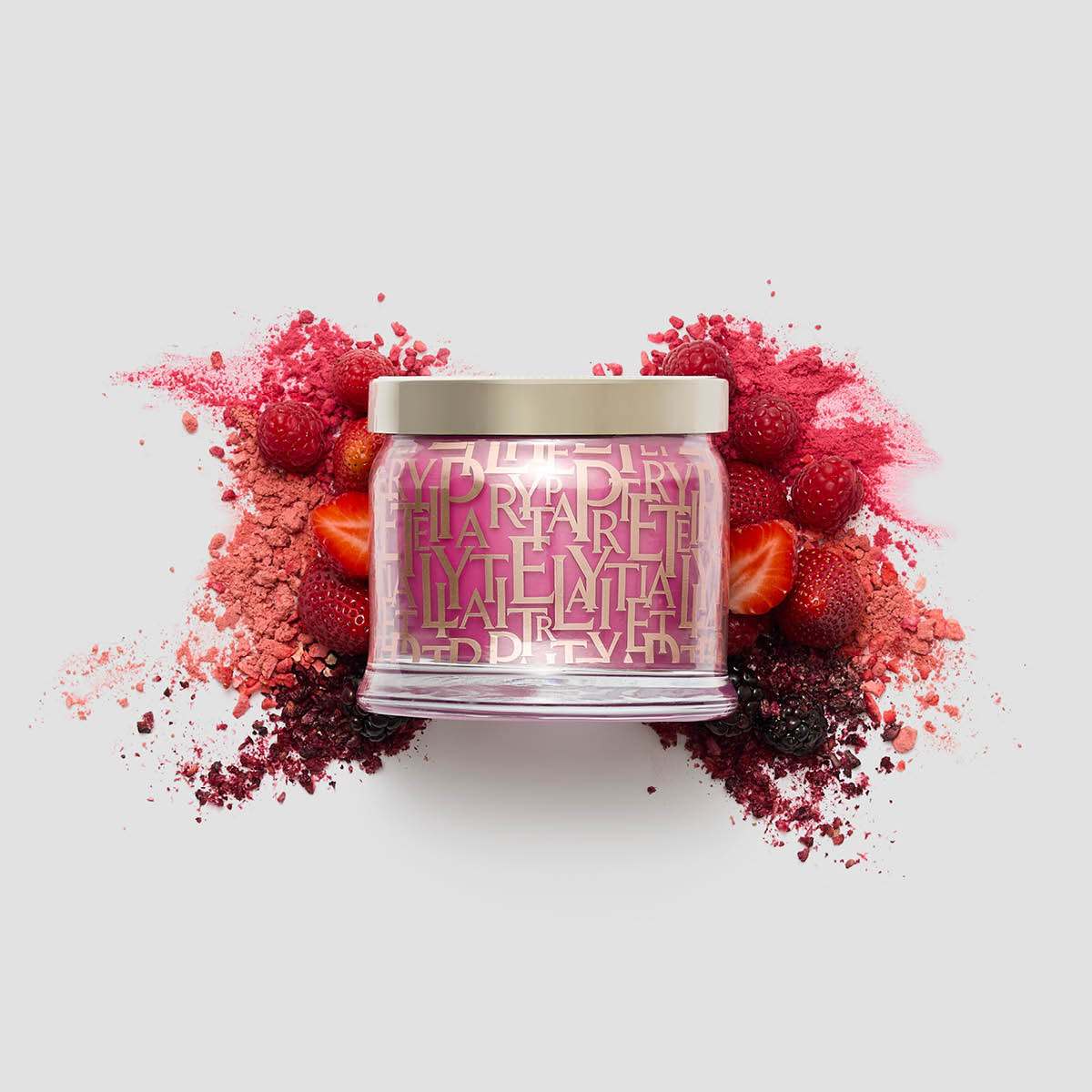Berry Blast 3-Wick Jar Candle surrounded by berries on a white background.