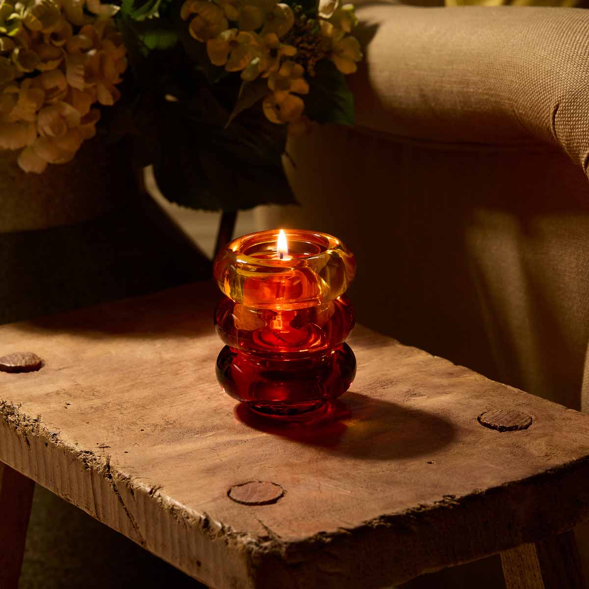 Golden Honey Tealight Holder Trio stacked on top of each other on a wooden surface.