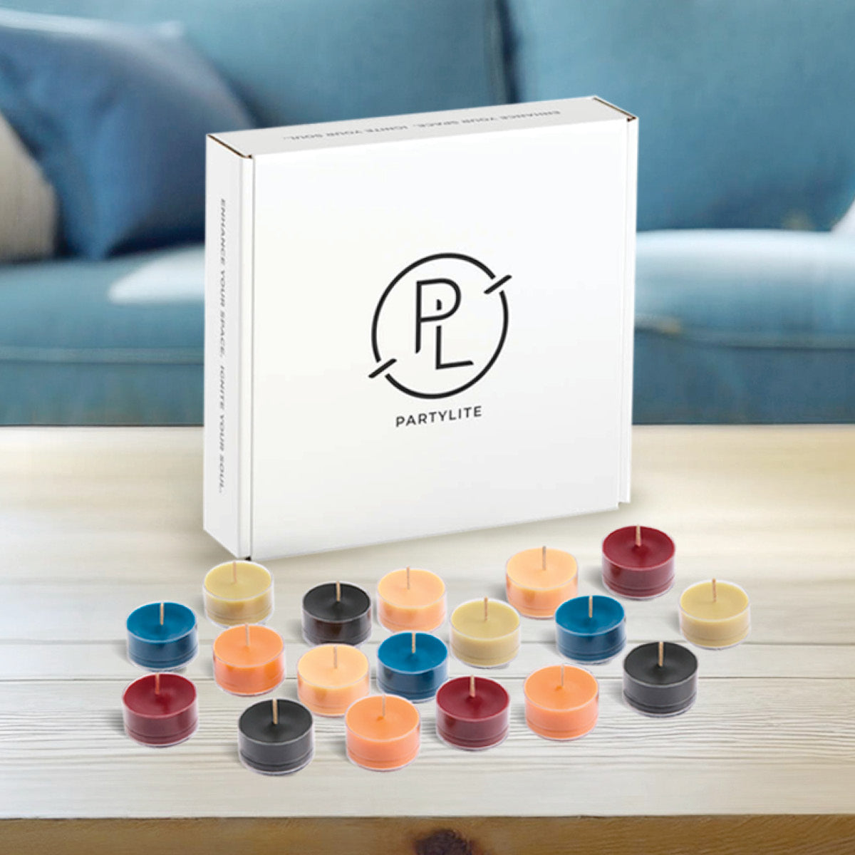 50-piece Tealight Sampler, colorful tealights on wooden table with the tealight packaging.