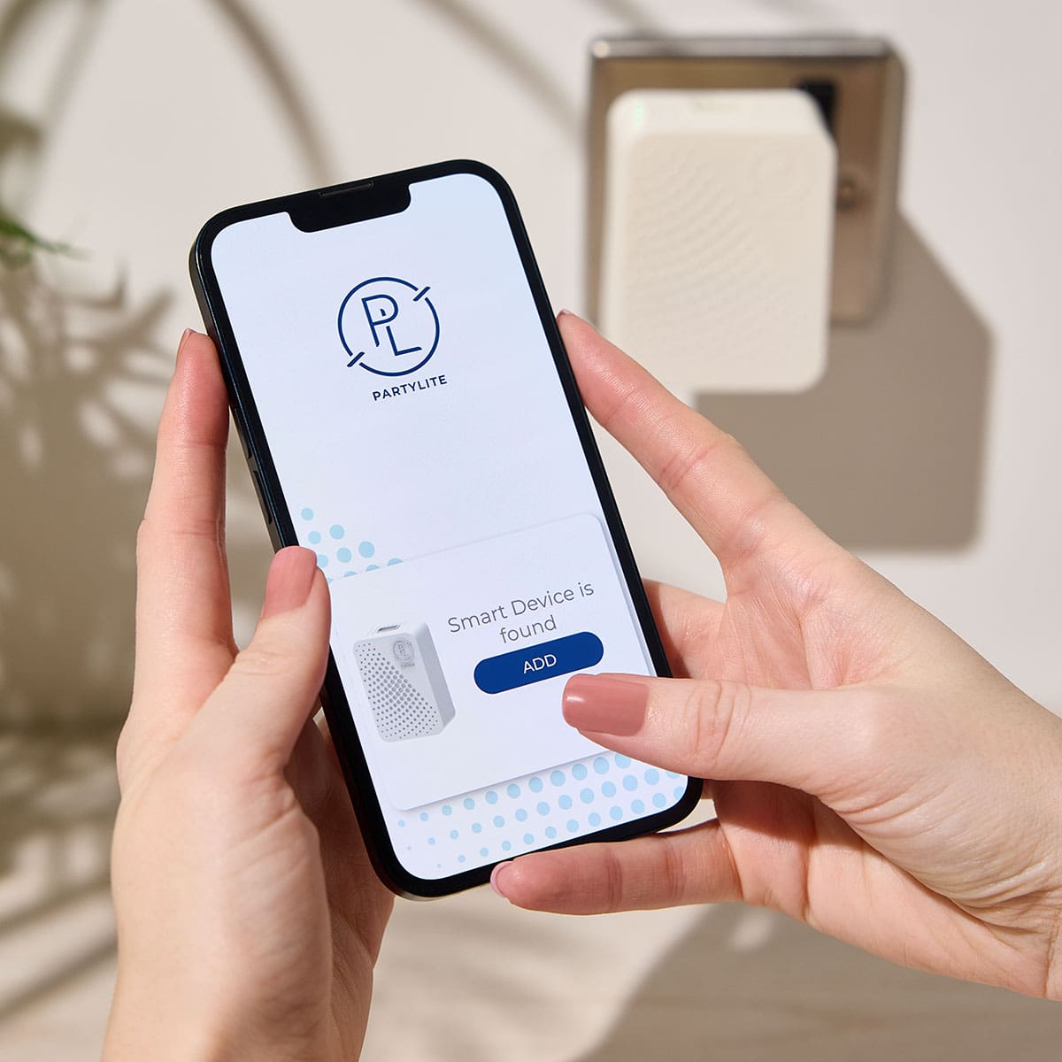 Smart Plug in App shown on a smart phone with the Smart Plug in shown in a light background