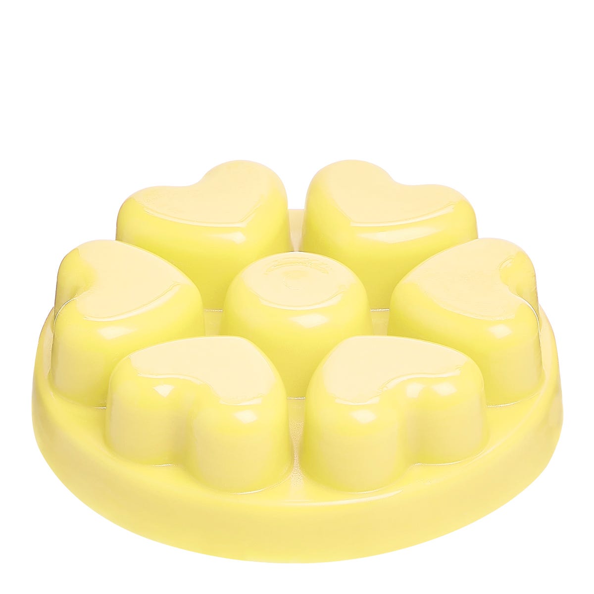 A yellow heart-shaped wax melts against a white background.