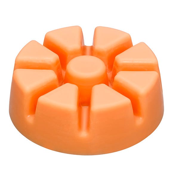 Peach Honey Citronella Orange-colored wax melts designed to be used in a scent warmer against a white background.