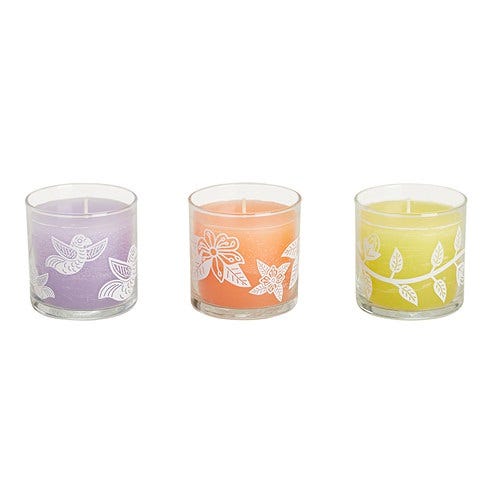 Three Citronella Mini Jar candles from PartyLite, with tropical designs and different colored wax, displayed side by side.