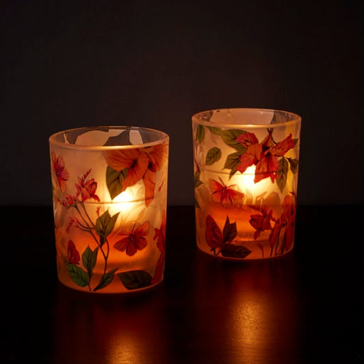 Afternoon Breeze Tealight Candle Holder Pair shown with lit tealights against a dark background.