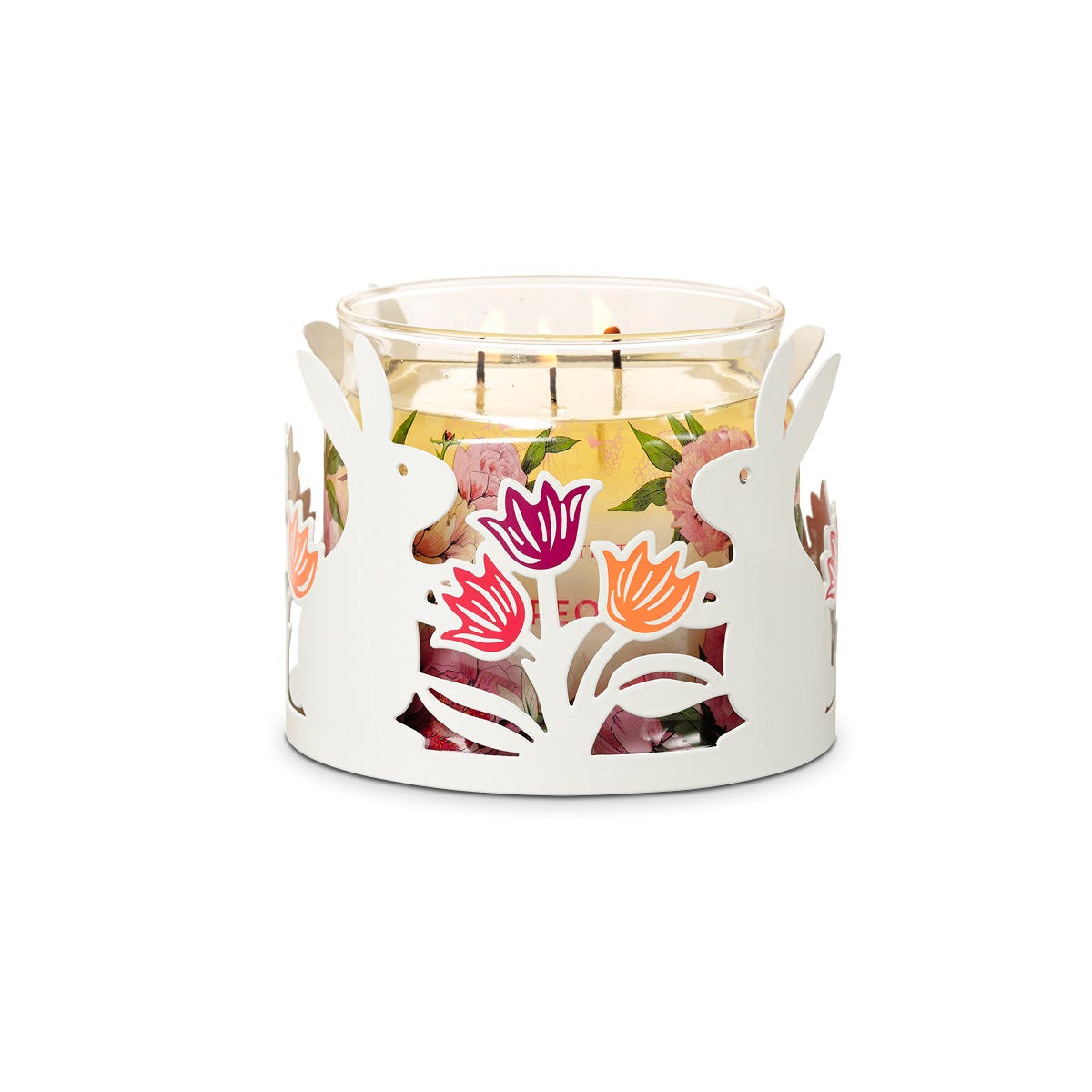 Hoppity white Jar Candle Holder with rabbits shapes and colorful flower heads shown with a lit 3-wick jar candle, against a white background.