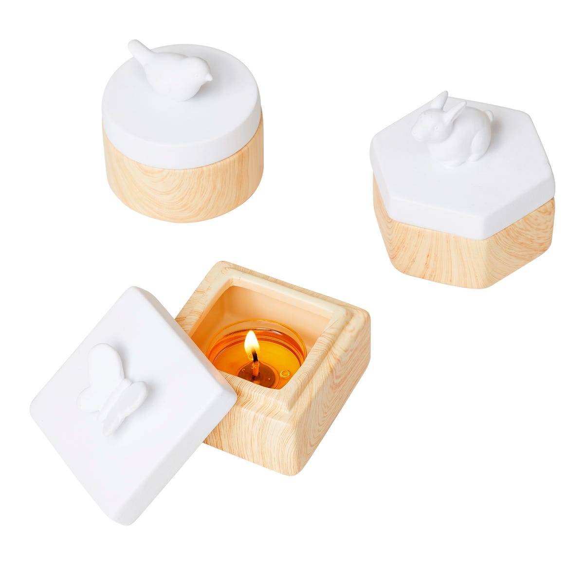 Spring Pals Tealight Candle Holder Trio wooden bases with white lids with either, a rabbit, butterfly and a bird against a white background.