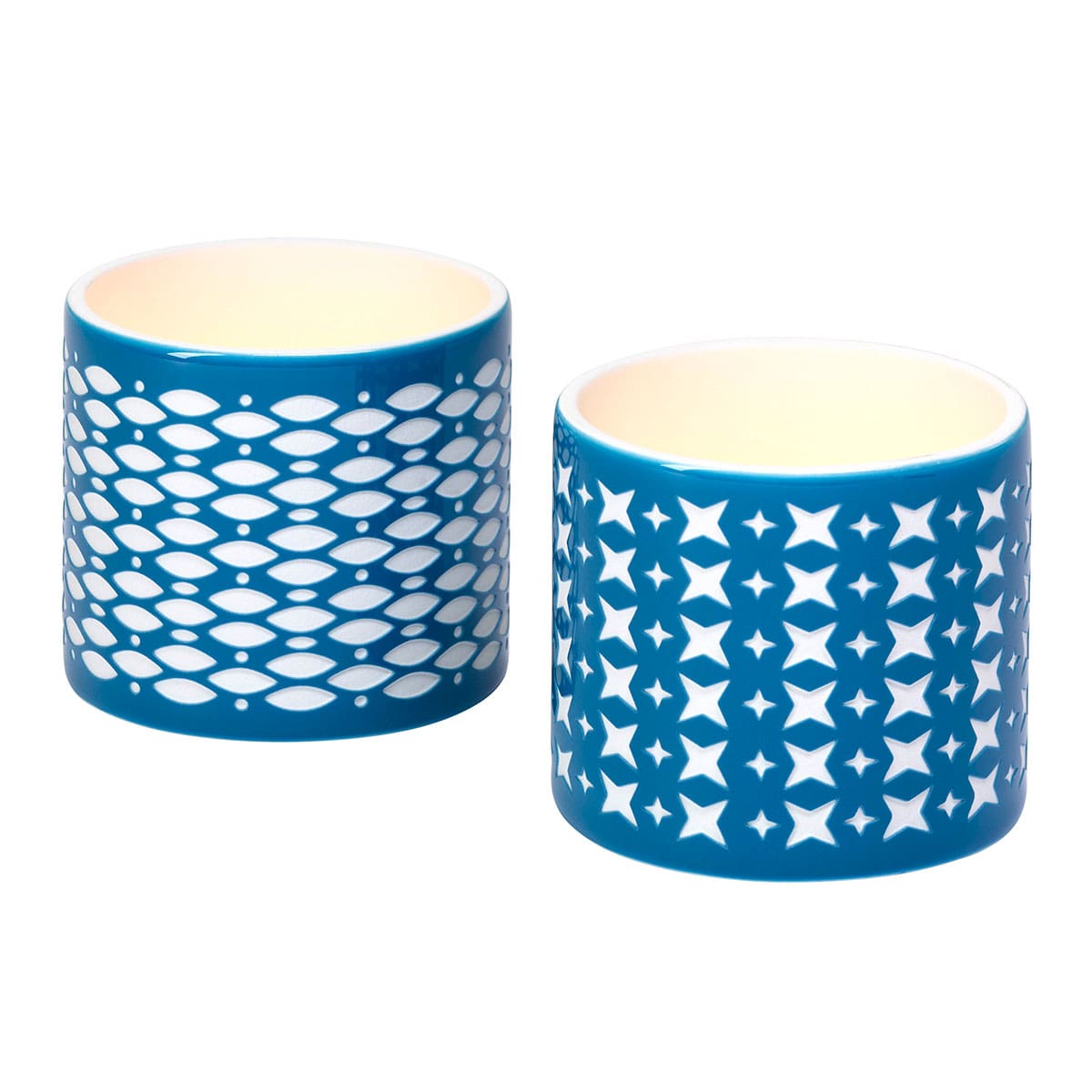 Grecian Tealight Candle Holder Pair blue color with patterns on against a white background.