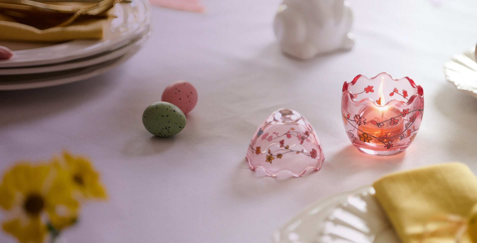 Easter pink with flowers tealight holder on a table setting.