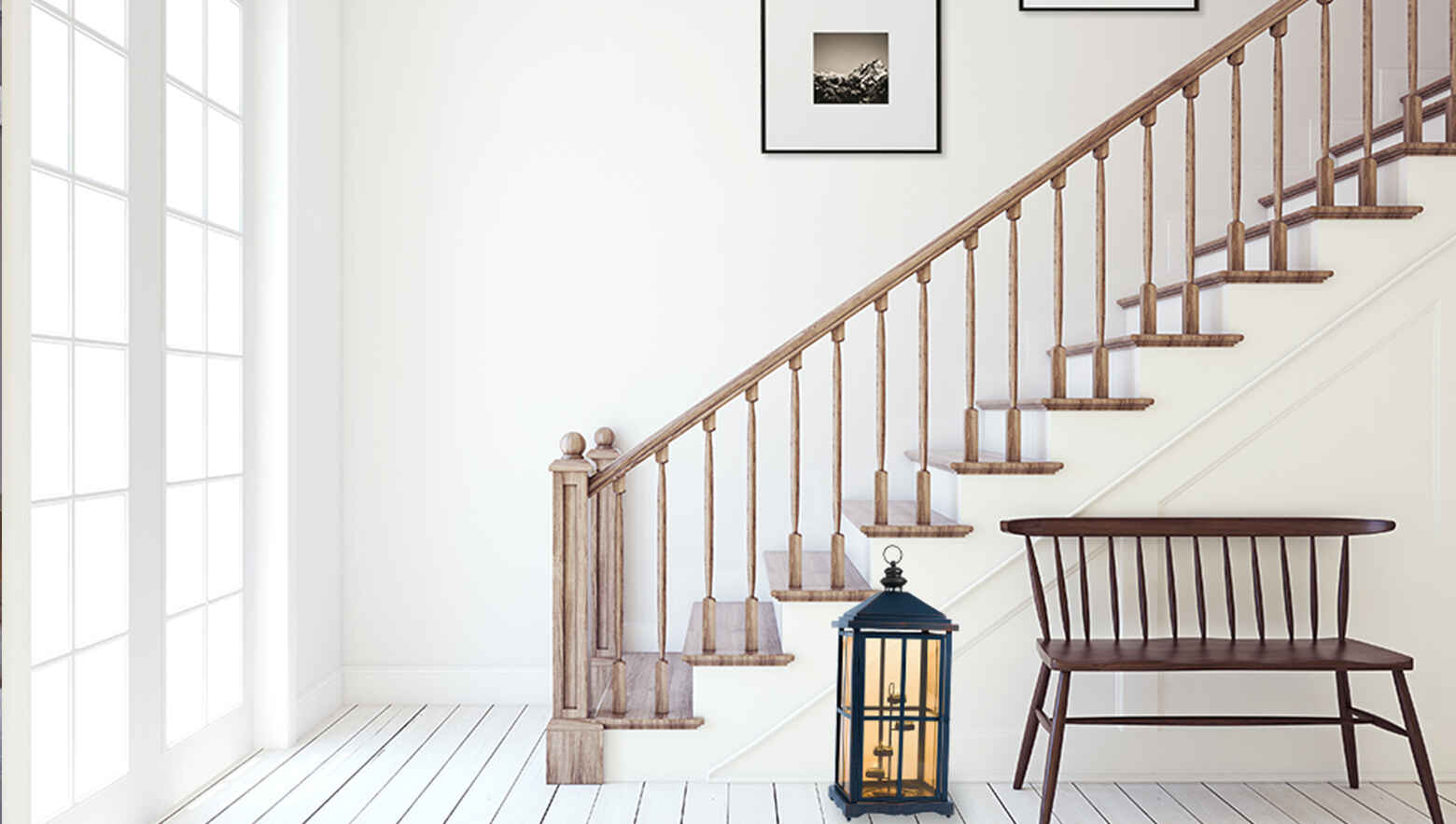 Stair case with wooden railings and a wooden chair with a lantern 
