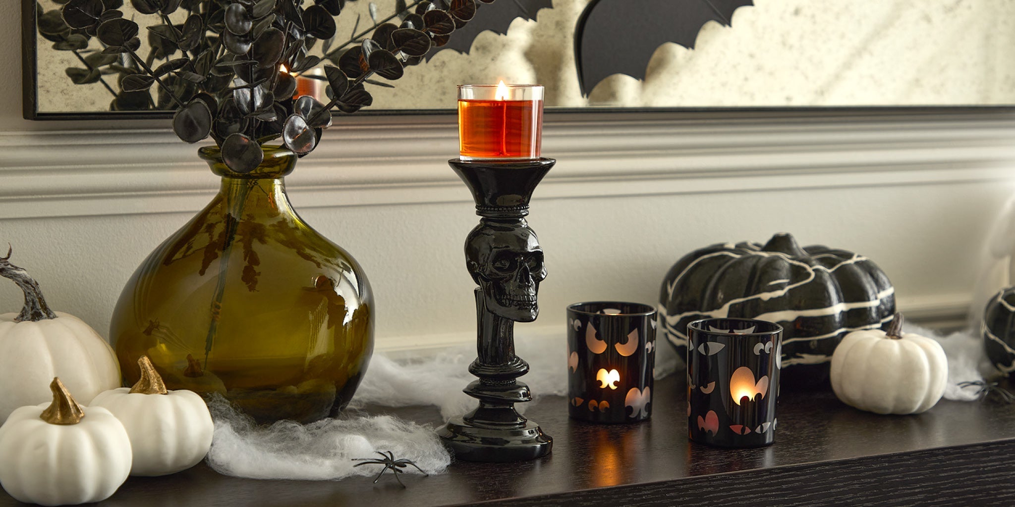 Halloween display with skull candle holder and spooky eyes tealight holder