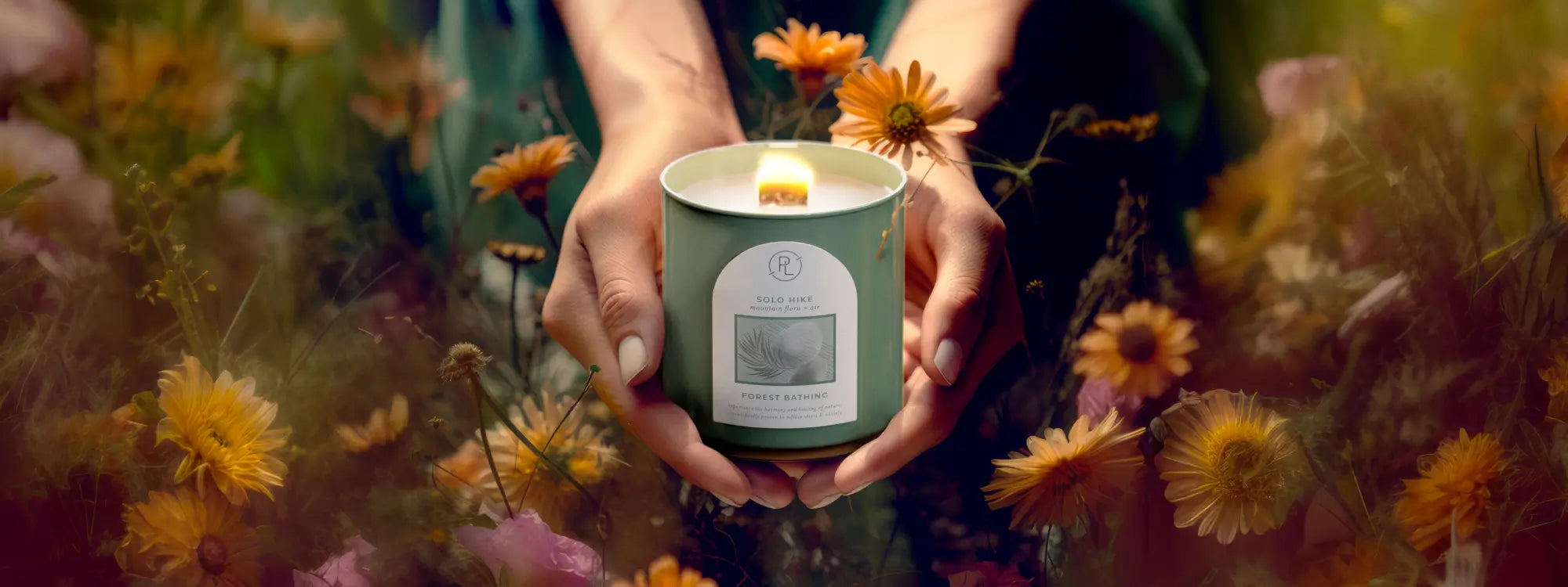 forest bathing jar candle held in a field of flowers