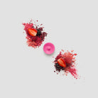 Berry Blast single tealight with berries against a white background.