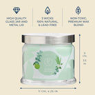 3-wick jar candle with green label and metal lid, featuring product details on a beige background.