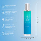 Blue room spray bottle with silver cap on a light blue background, featuring text about product features.