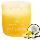 Optimistic, yellow color Jar Candle from the Mood Collection against a white background, with lemon and coconut.