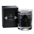 Forbidden Fruits Jar candle shown with it's box against a grey and black chequered background.