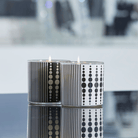 Monochrome Jar Candle pair in black and white colors against a reflective surface.