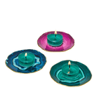 Faux Agate Tealight Holder Trio in blue, green and pink colors shown with lit tealighrts.