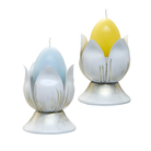 Tulips Candle Holder Pair ina white color with glod flecks show with a blue and yellow egg candles against a white background.