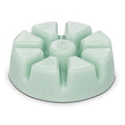 Honeydew wax melts in a mint green color against a white background.