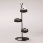  Bronze-tone universal tealight tree shown with lit tealights against a white background.
